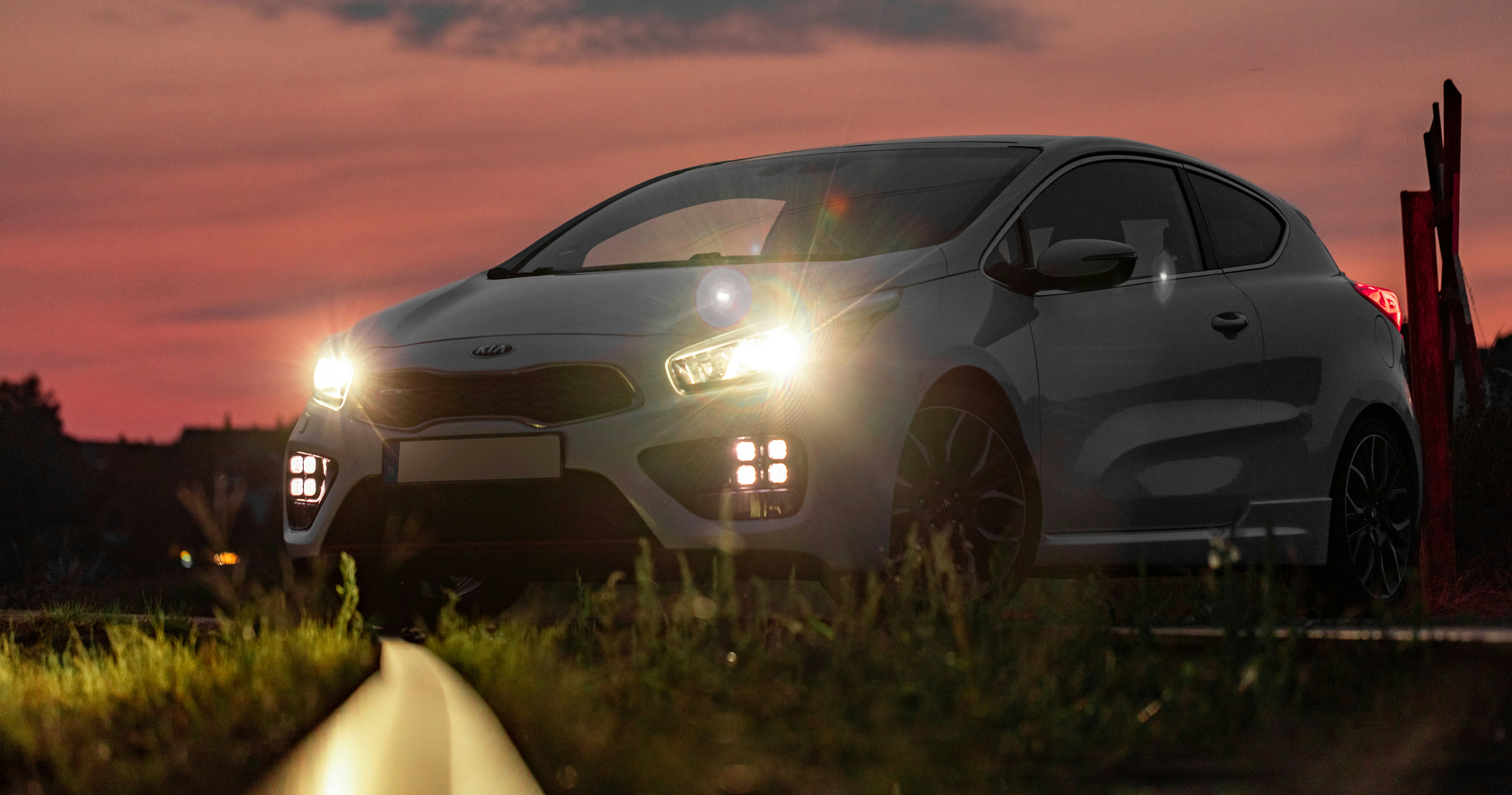 silver honda car on green grass field during sunset